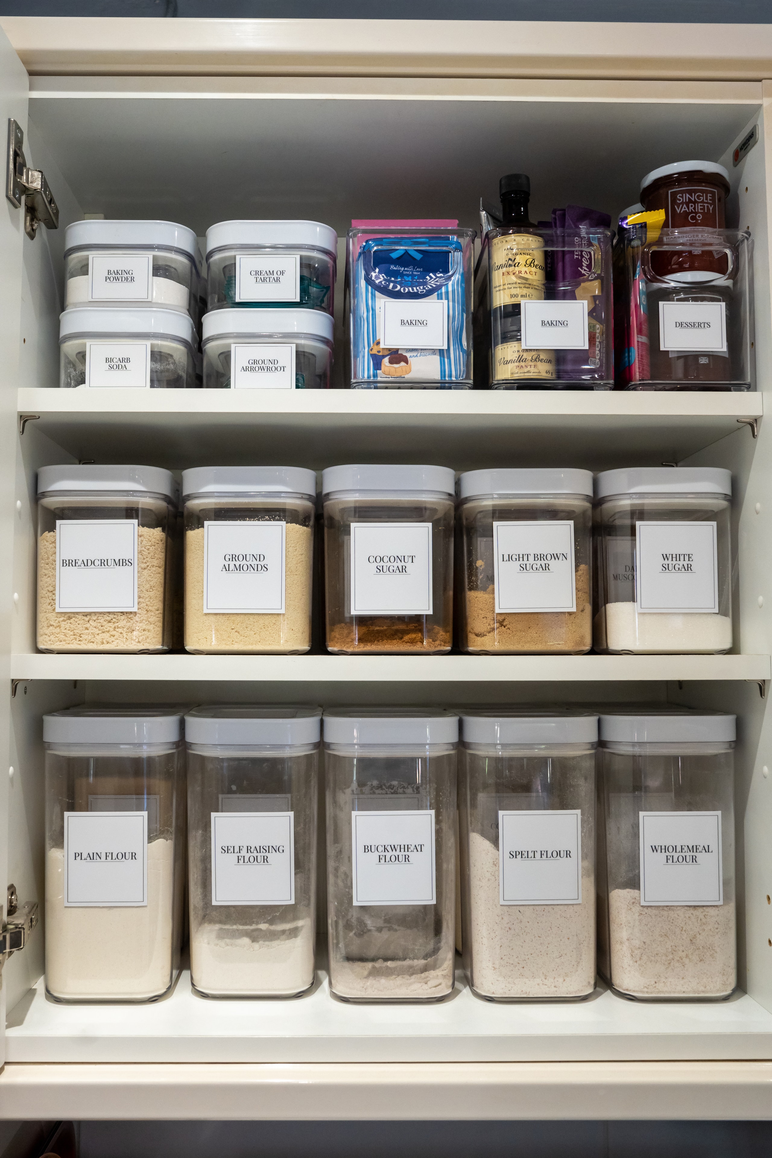 Organised pantry with labelled containers